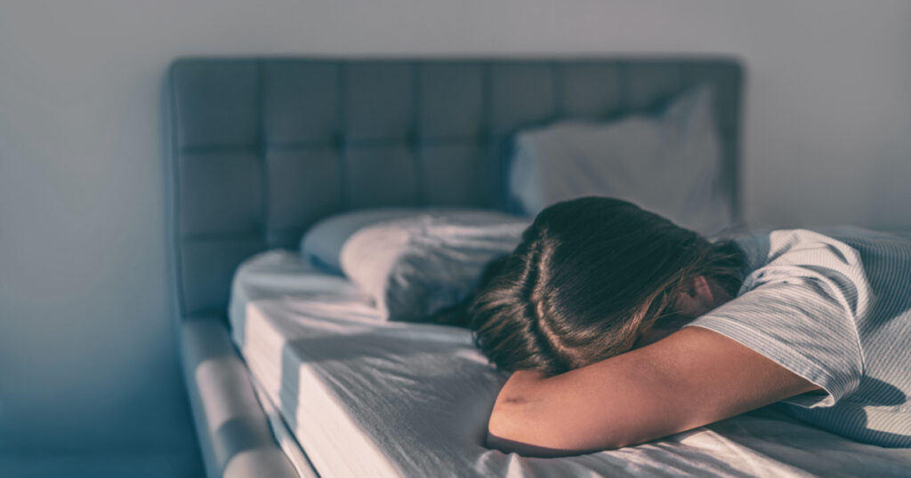 Home quarantine self isolation woman tired bored cant get up of bed staying asleep late sleepiness sleep disorder. Sad girl crying alone.