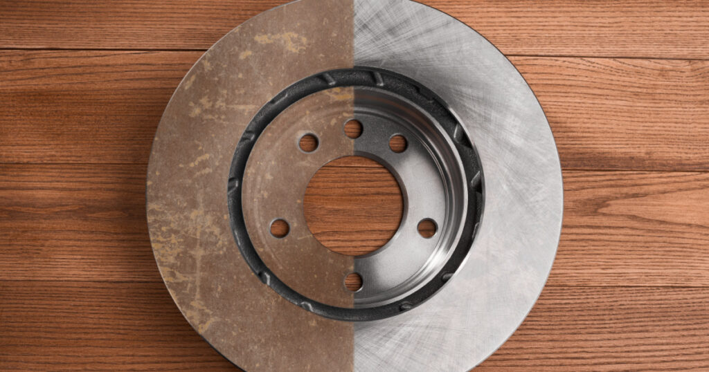 Top view on a half-cleaned brake rotor. Result of removing rust from a rotor surface. Car treatment and repair concept.