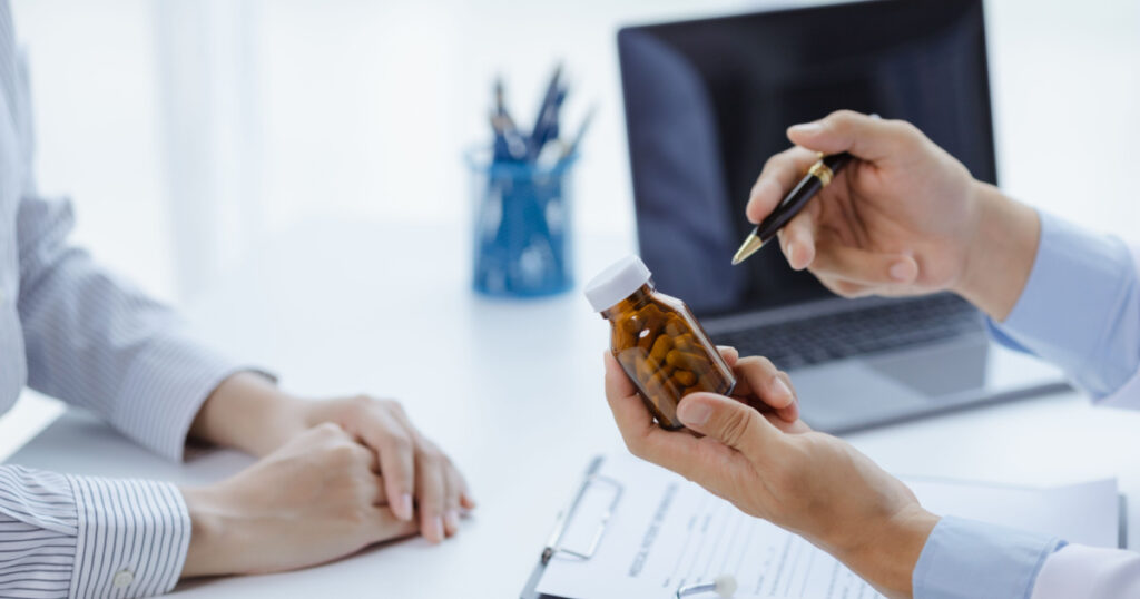 Doctors are giving advice on medication to patients in hospital examination rooms, treating diseases from specialists and providing targeted treatment. Concepts of medical treatment and specialists.