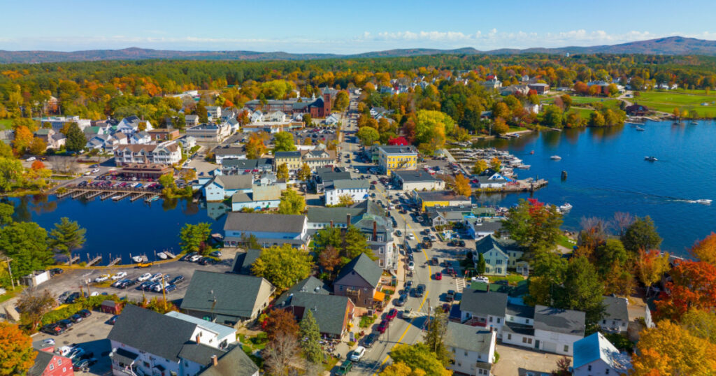 Wolfeboro historic town center at Lake Winnipesaukee aerial view in fall on Main Street, town of Wolfeboro, New Hampshire NH, USA.