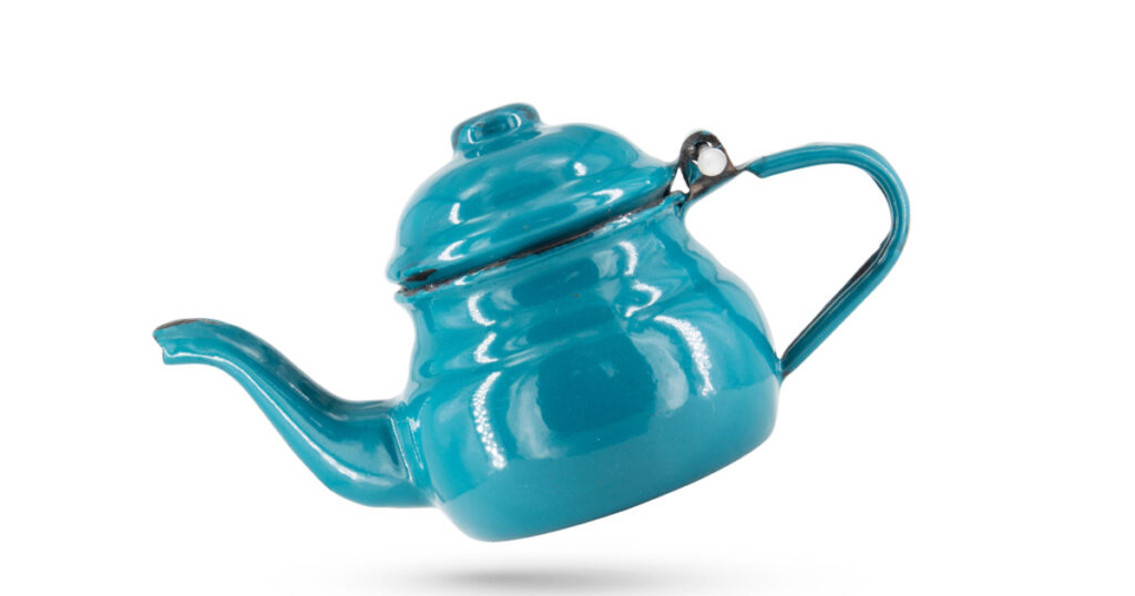 Vintage metal old blue kettle isolated on white background