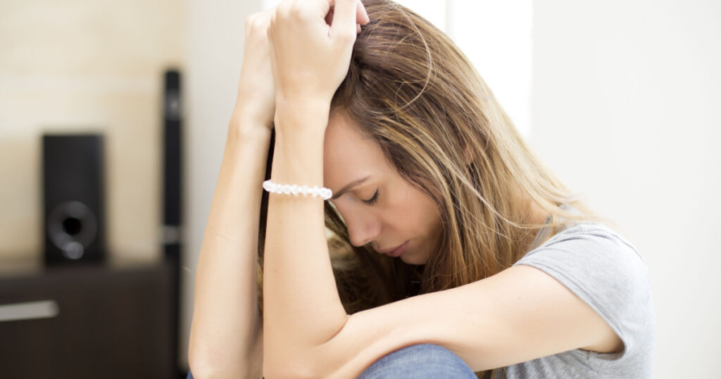 Sad woman in the room