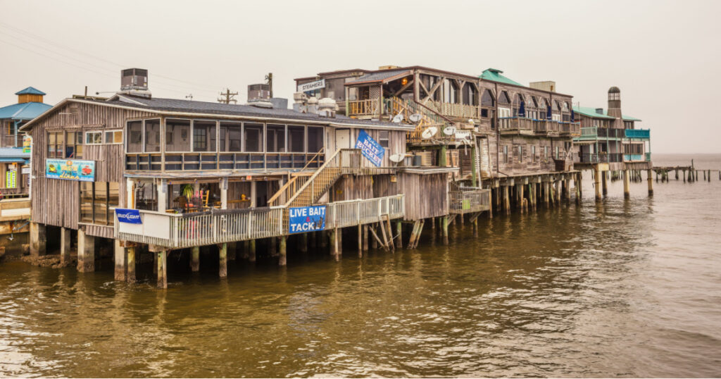 CEDAR KEY, FLORIDA - JANUARY 15, 2015 : Waterfront buildings on stilts in the historic downtown Cedar Key. Cedar Key is in the National Register of Historic Places since 1989.