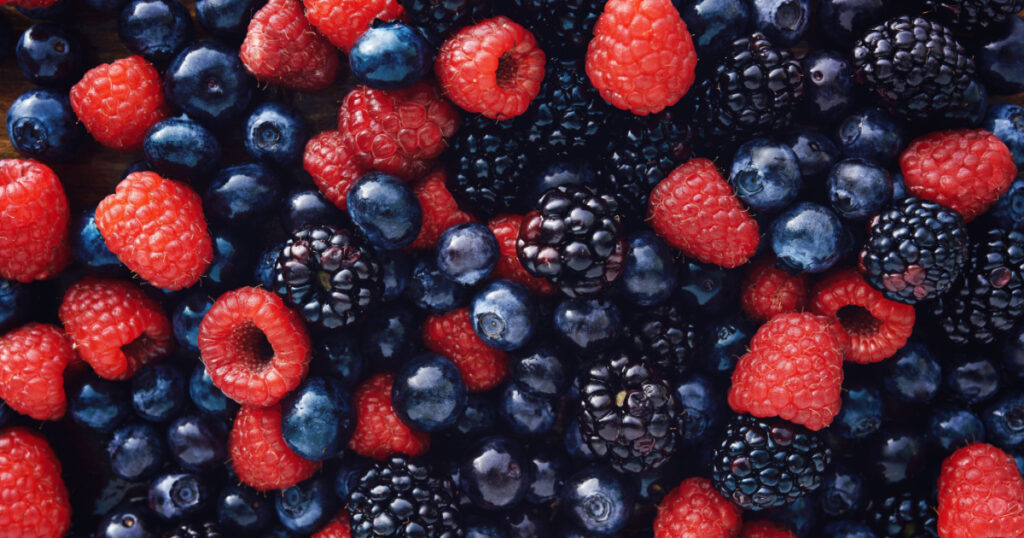 blueberries, raspberries and black berries shot top down