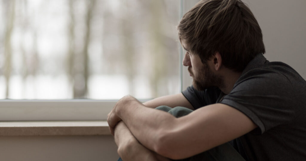Portrait of young man suffering for depression