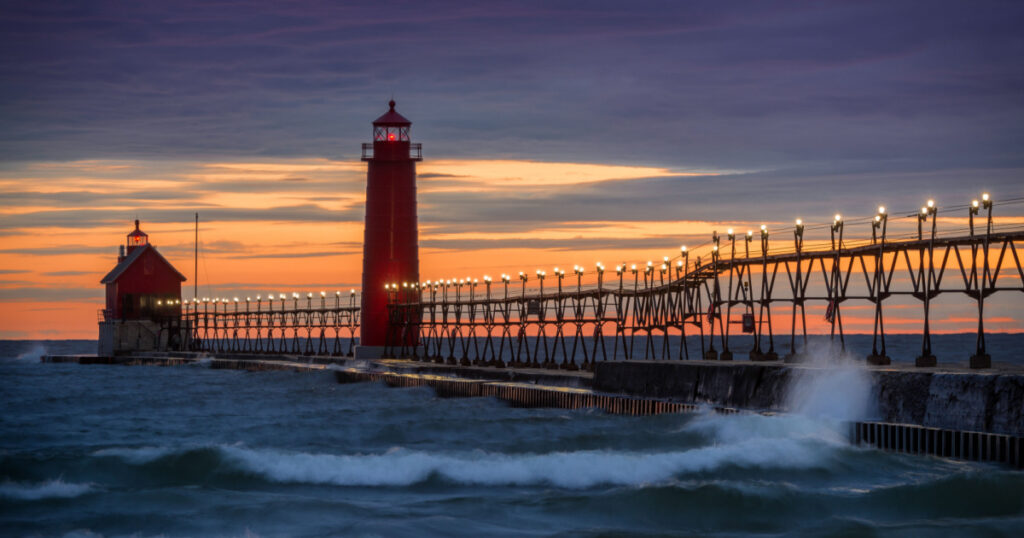 Sunset at the Grand Haven South Pierhead Inner Light with Entrance Light in background in Grand Haven State Park in Grand Haven, Michigan