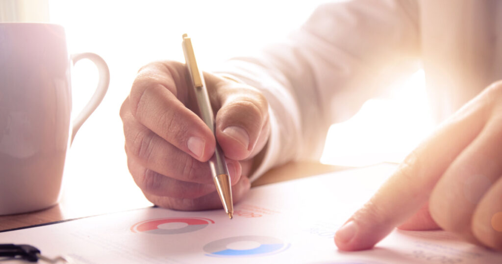 Businessman study financial report. Concept for business, finance, market research, analytics and statistics, marketing.