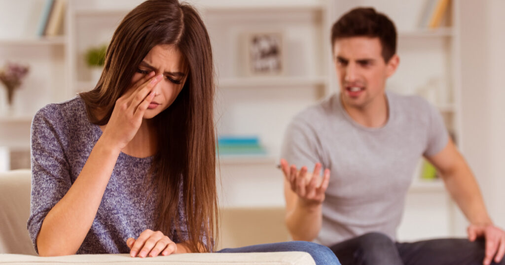 Young couple quarrels among themselves at home, his wife was crying because her husband, at home