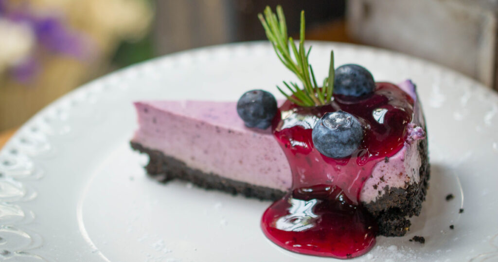 fresh blueberries cheese pie and chocolate biscuits