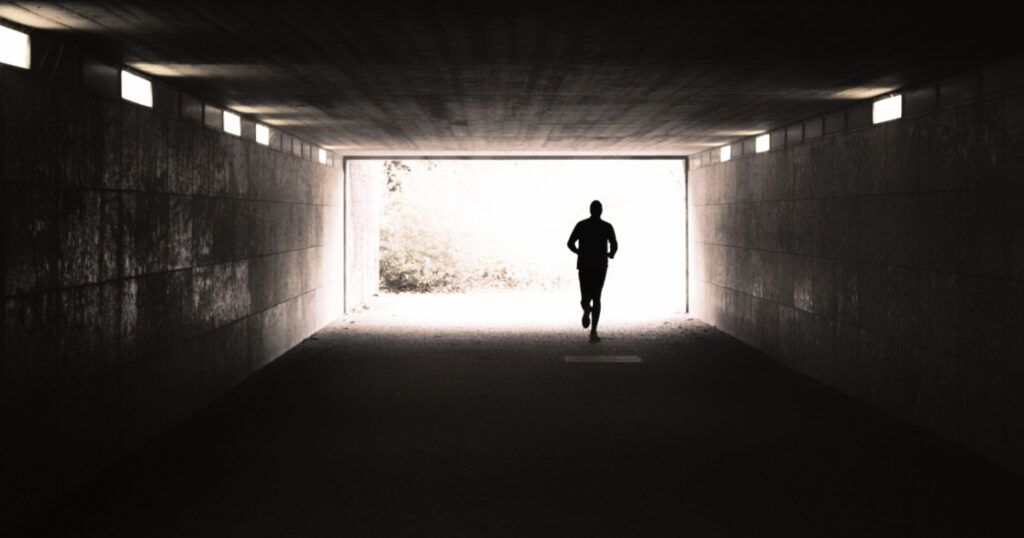 Jogger runs into light