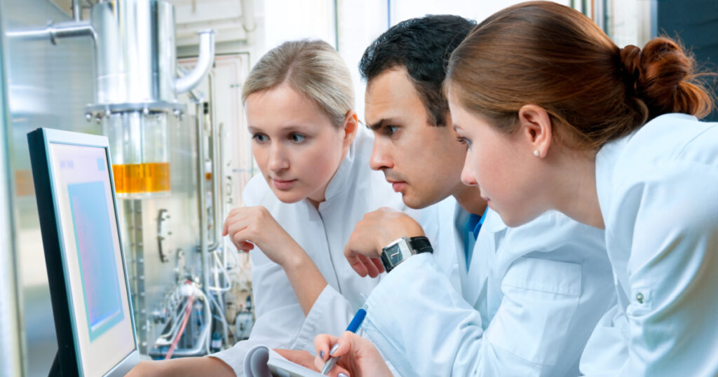 group of scientists working at the laboratory