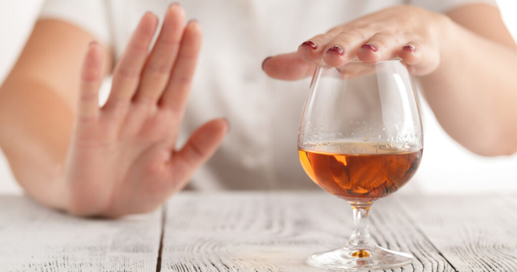 woman refuses to drink a alcohol