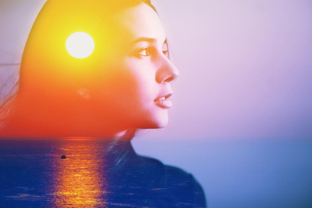 Human soul energy power spirit, inner peace, mental health therapy feel help gut care concept. abstract art portrait of happy woman head face side portrait look at sun sea nature sunrise sunset in sky
