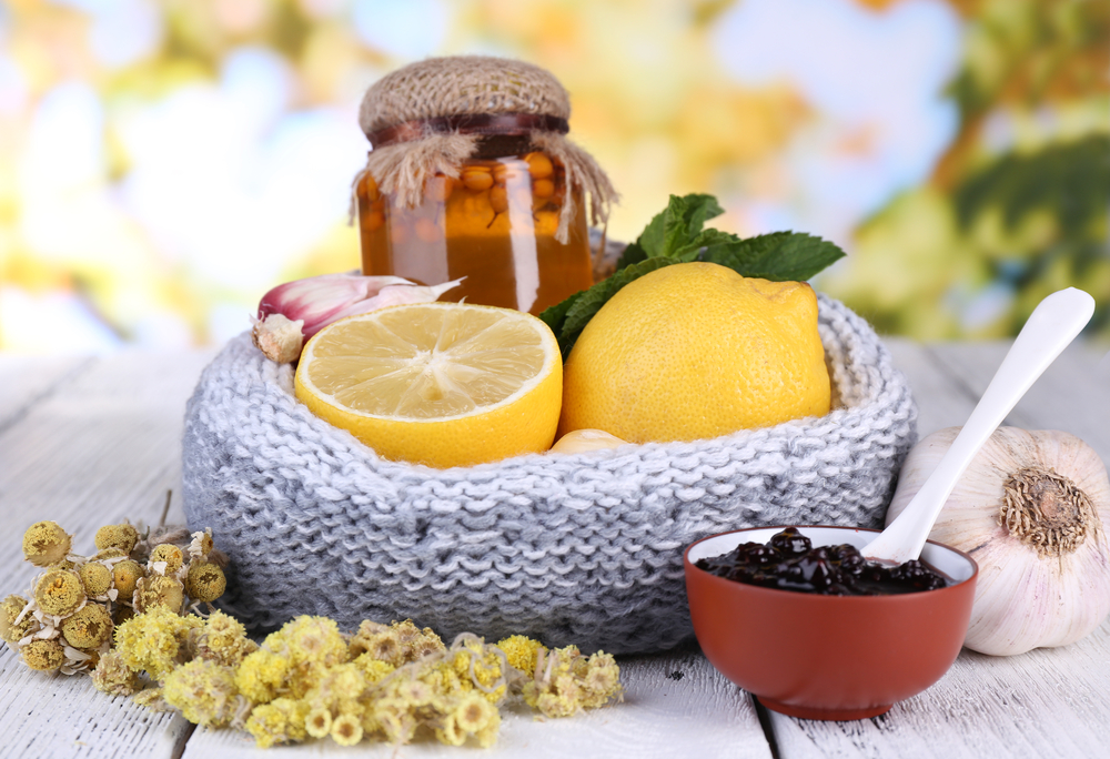 Folk remedies for colds on table on natural background
