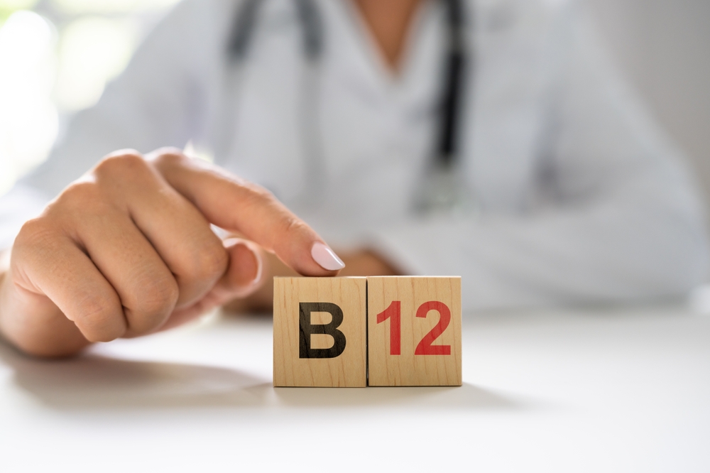 Vitamin B12. Medical Doctor Hand In Hospital