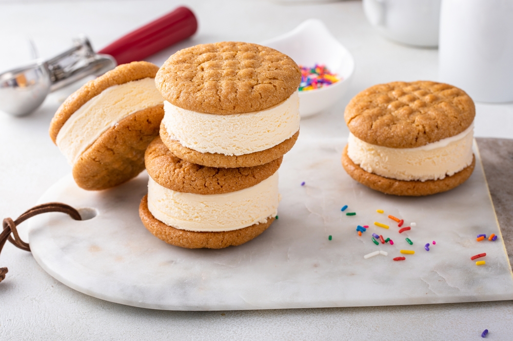 Ice cream sandwiches with vanilla ice cream and peanut butter cookies and sprinkles
