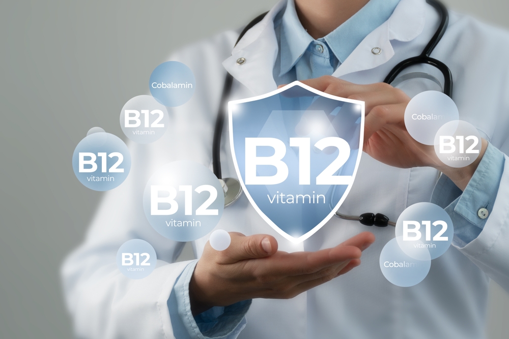 Molecular model of vitamin B12. Shield in doctor`s hands with Vitamin B12.