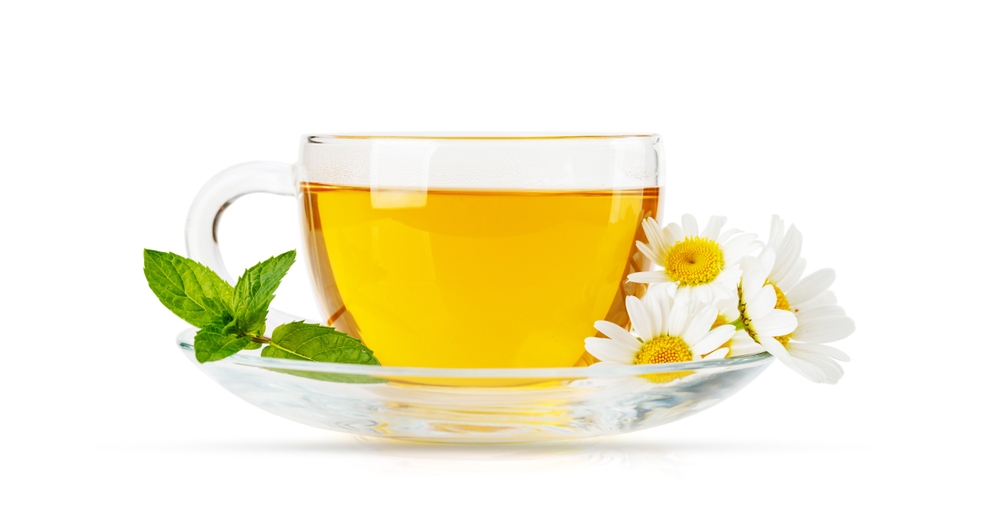 Soothing herbal tea blend with mint and chamomile. Isolated on white background
