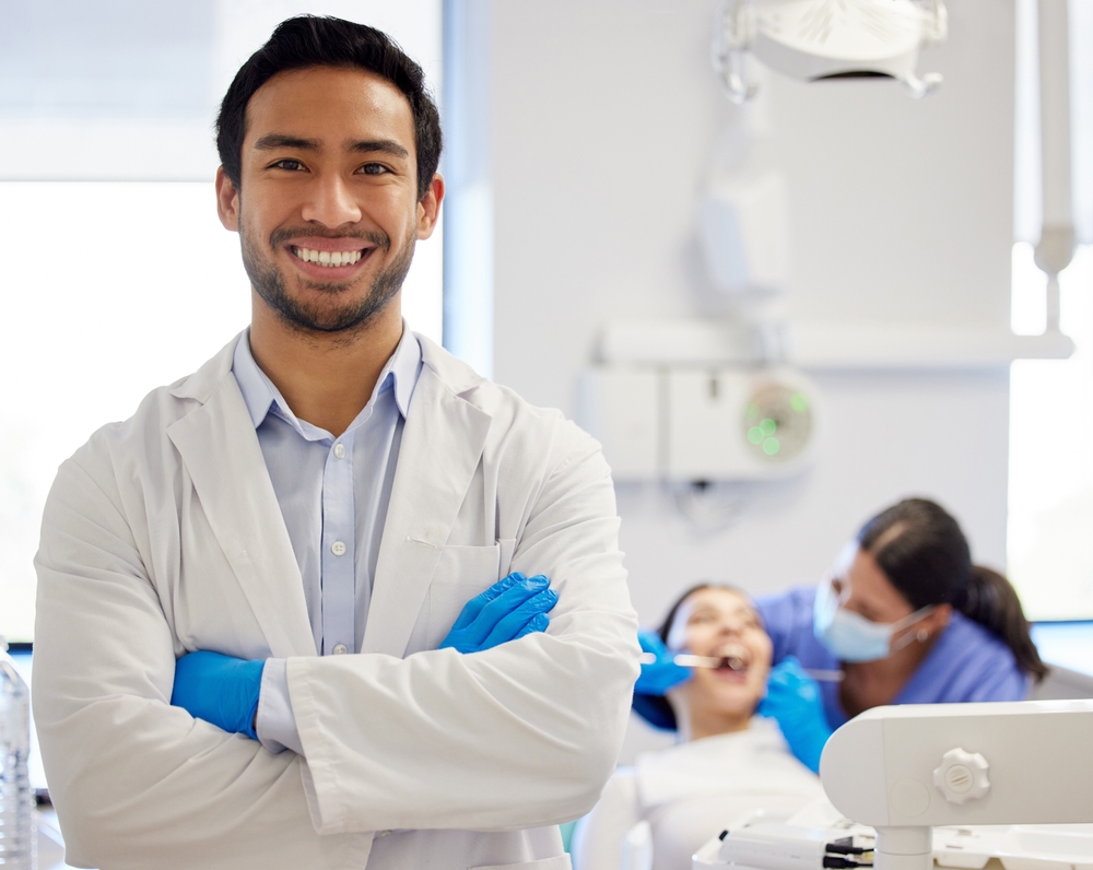 Dentist, portrait and arms crossed or dental patient for toothache, health and treatment for mouth. Face, teeth whitening and person with clean procedure orthodontics and oral, care for inspection