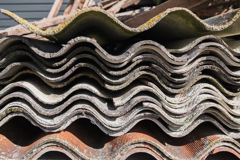 Old and very dangerous asbestos roof. Asbestos dust in the environment. Health problems.
