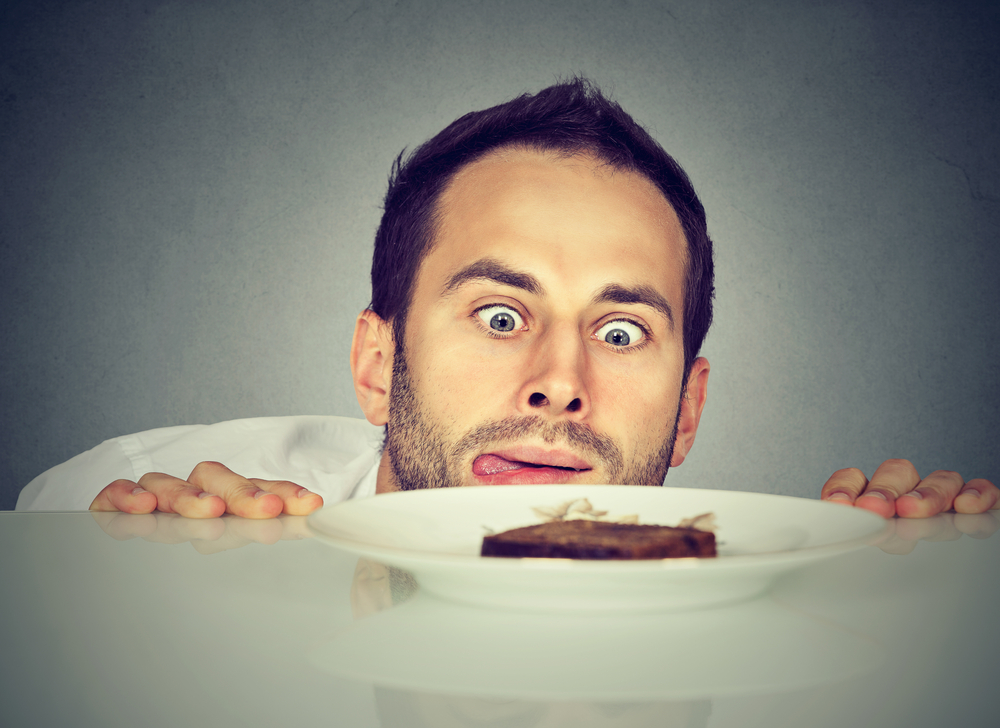 Hungry man craving sweet food
