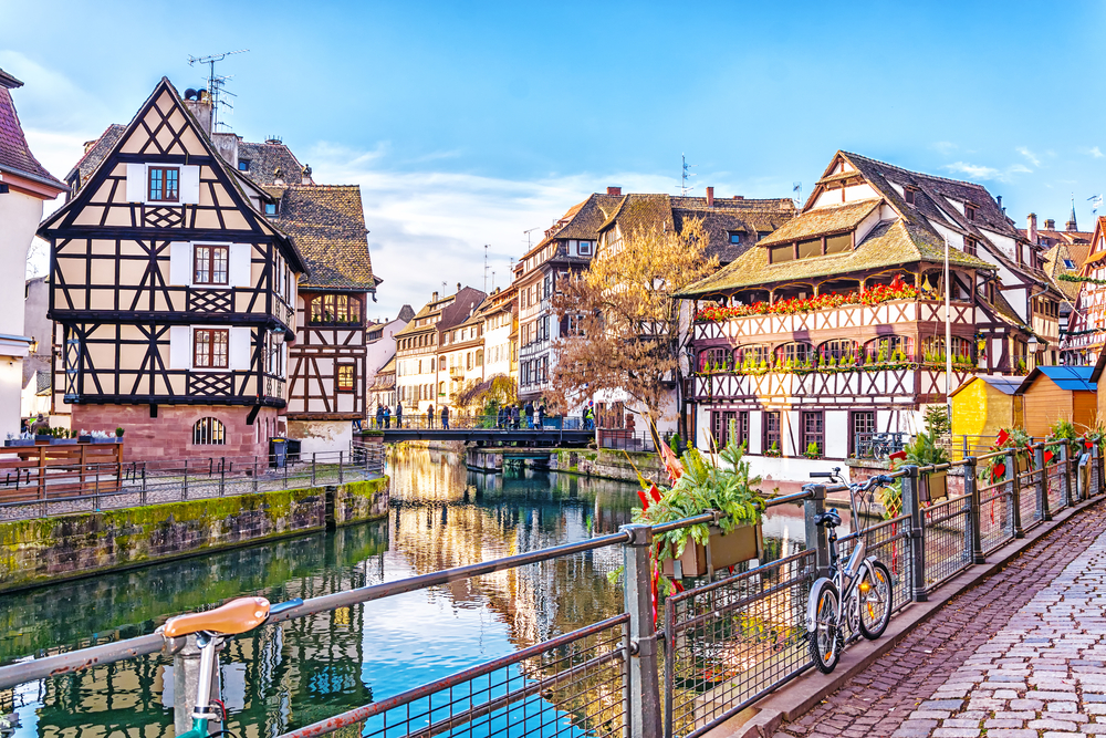 Traditional half-timbered houses on picturesque canals in La Petite France in the medieval fairytale town of Strasbourg, UNESCO World Heritage Site, Alsace, France.
