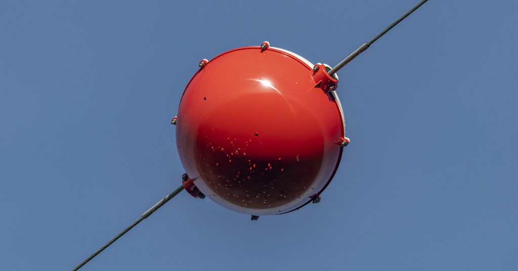 What Are Those Colorful Balls You See on Power Lines? - Featured image