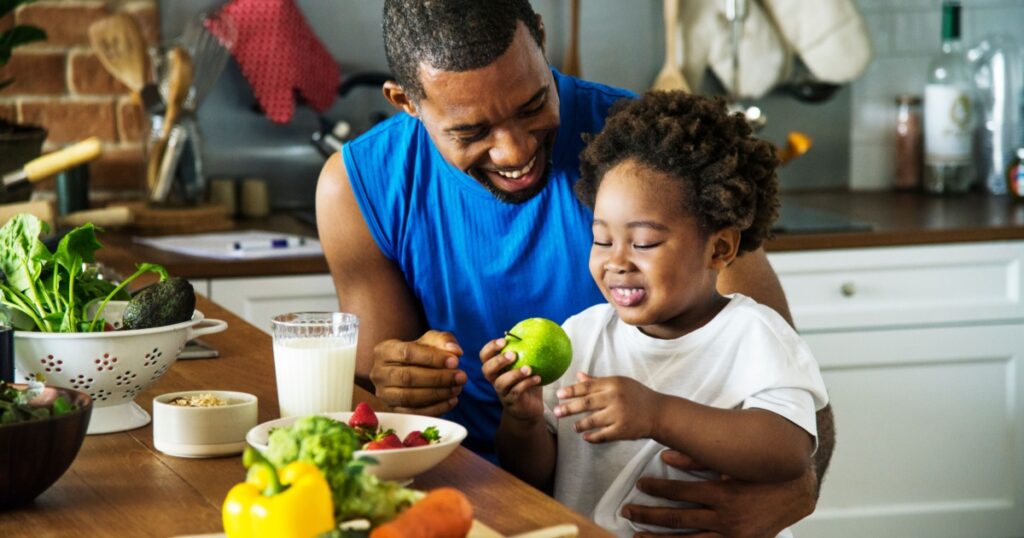 Dad and son cooking together
