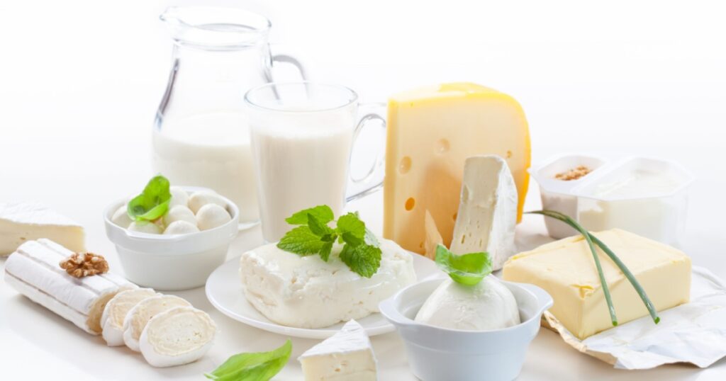 Assortment of dairy products on white background