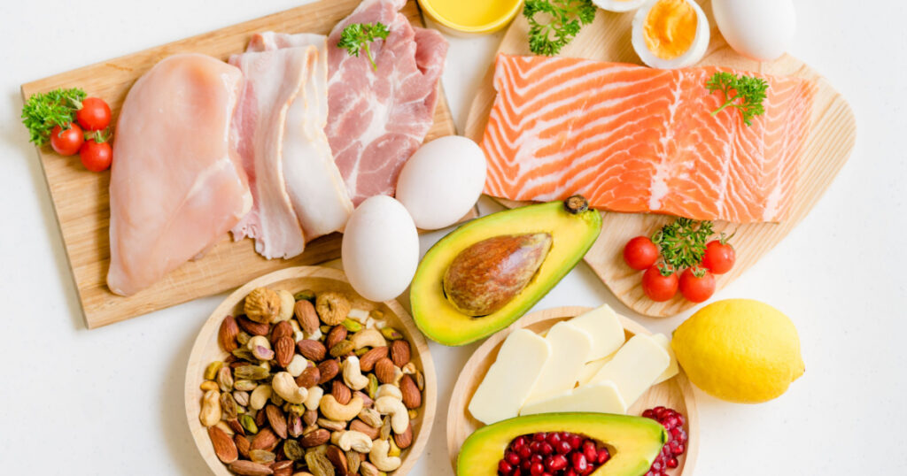 Keto picture.Flat lay of Keto diet food ingredients on white table.Ketogenic mean Low carb and High fat.Healthy food Concept.