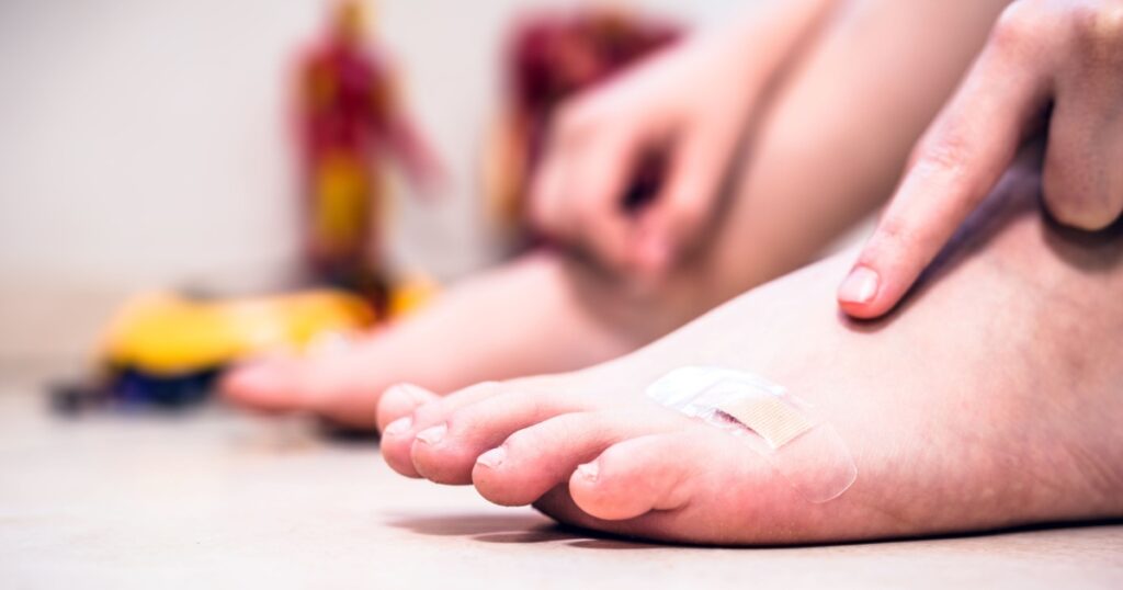 Pain or wound in a boy's foot. Childish wound, slow healing.
