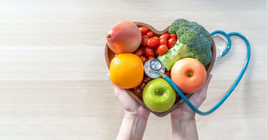 Nutritional food for heart health wellness by cholesterol diet and healthy nutrition eating with clean fruits and vegetables in heart dish by nutritionist and doctor recommended for patient well-being