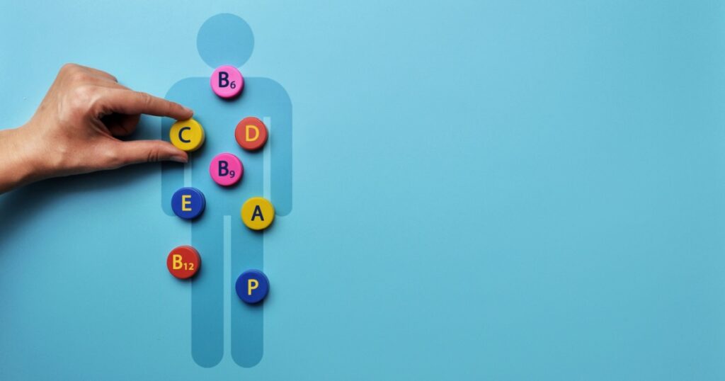 A silhouette of a man with an image of vitamins on it. A symbol of the need for vitamins for the body