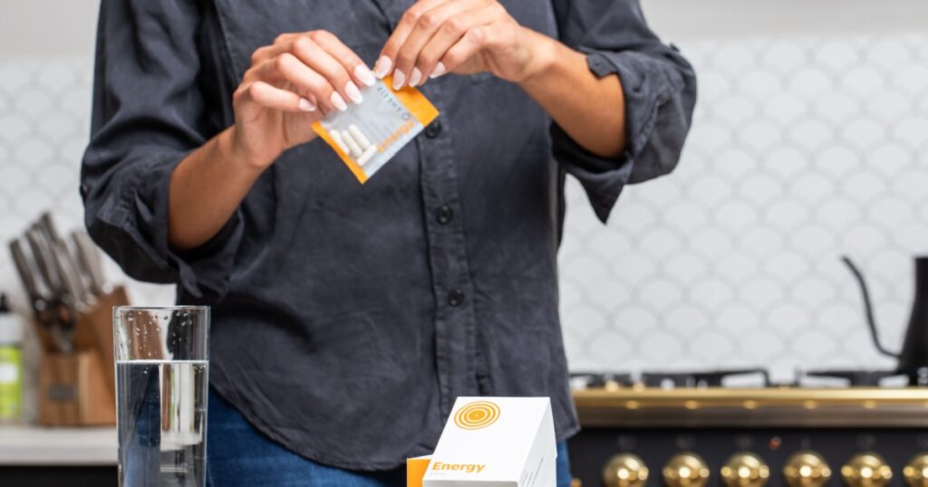 Opening pack of nootropics supplements in kitchen