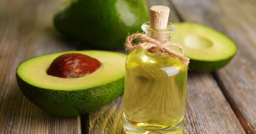 Avocado oil on table close-up