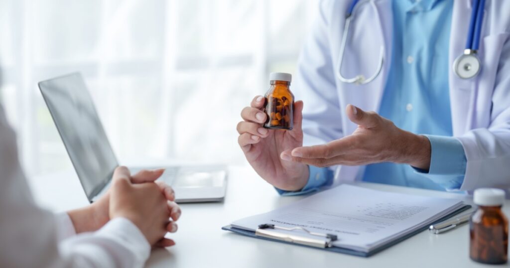 Doctor who records a patient's detailed information or medication history is evaluating medications and vaccines for the intended treatment. or if there are any side effects.