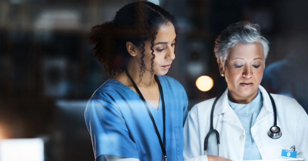 Women, doctors and tablet for night medical research, surgery planning and teamwork in hospital. Nurse, healthcare and worker collaboration on technology in late shift for wellness thinking and ideas