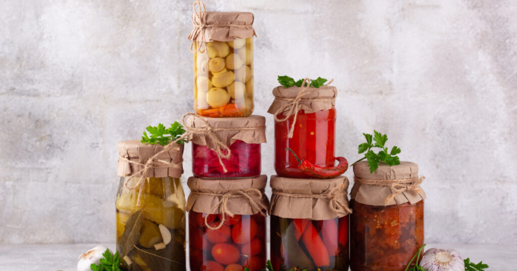 Pickled vegetables in glass jars.