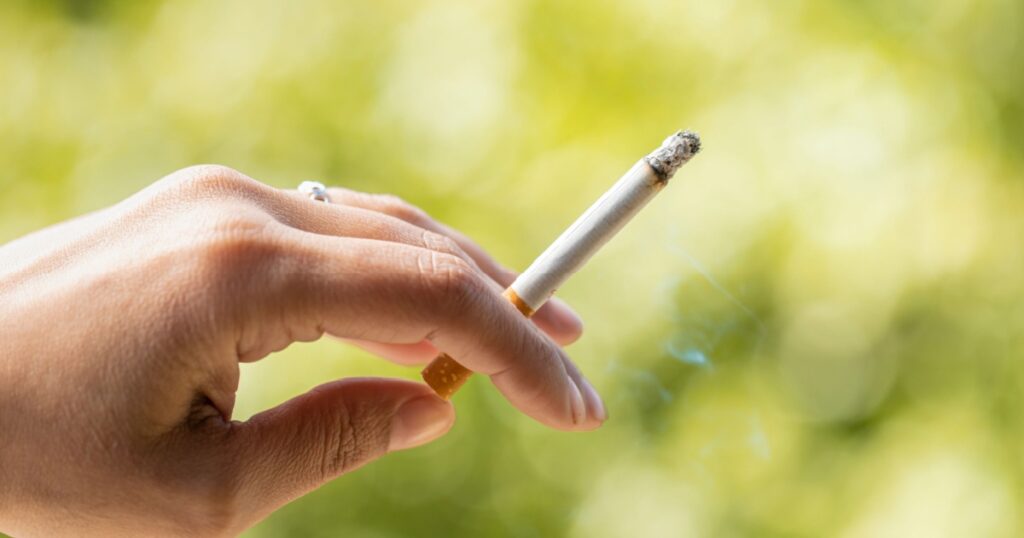 hand holding cigarette