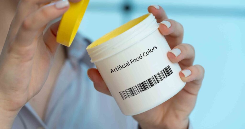 Artificial food colors: Synthetic dyes like Red 40, Yellow 5, and Blue 1 have been linked to hyperactivity and behavioral issues in children.