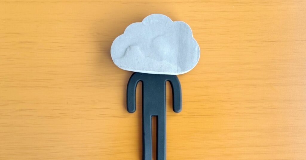 A cloud-shaped accessory on a black doll's head
