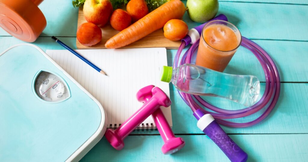 Healthy eating ,Workout and fitness dieting ,fitness and weight loss concept, fruit, Vegetable and water bottle,weight scale,top view on wooden background