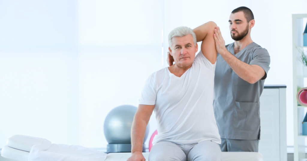 Physiotherapist working with patient in clinic