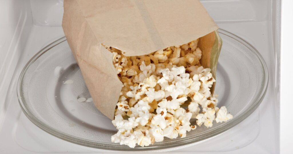 Popcorn cooked in a microwave oven still in the bag.