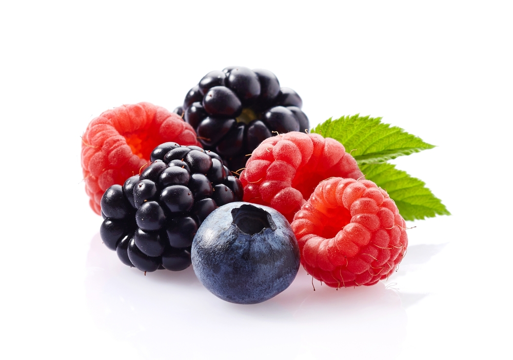 Mix berries with leaves in closeup
