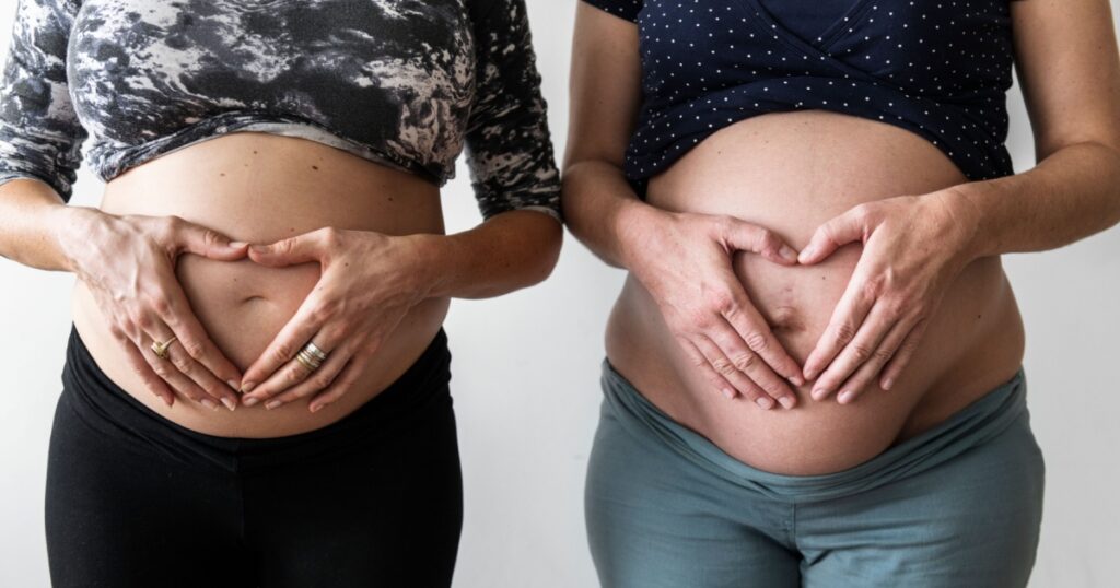 Pregnant women showing their bumps