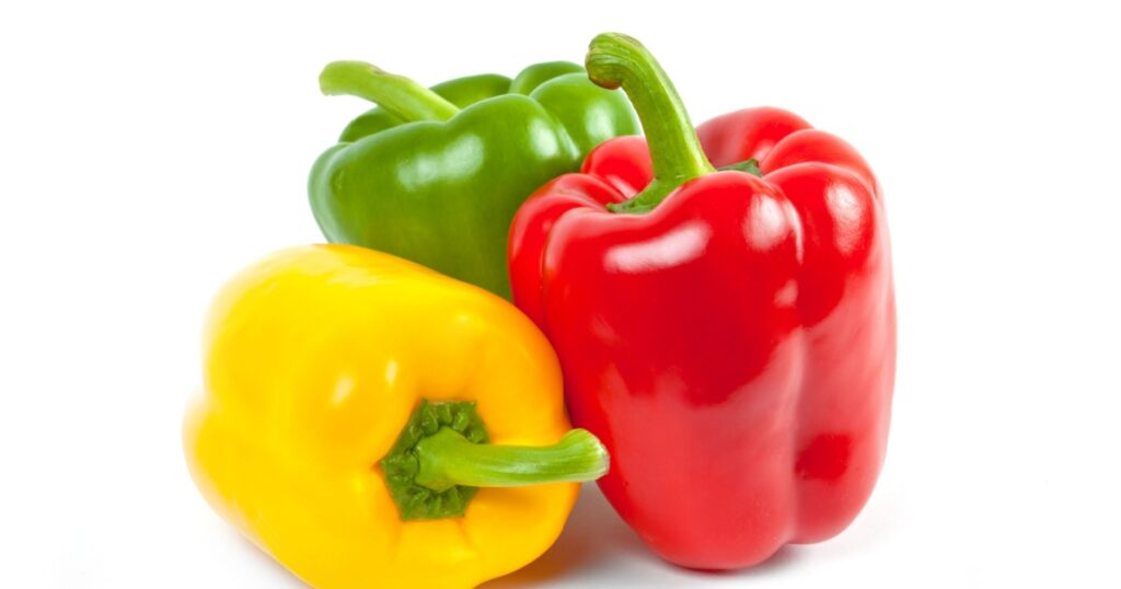 three bell peppers isolated on white background