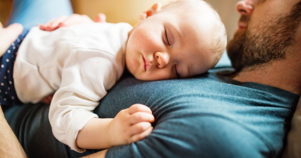 Father with a baby girl at home