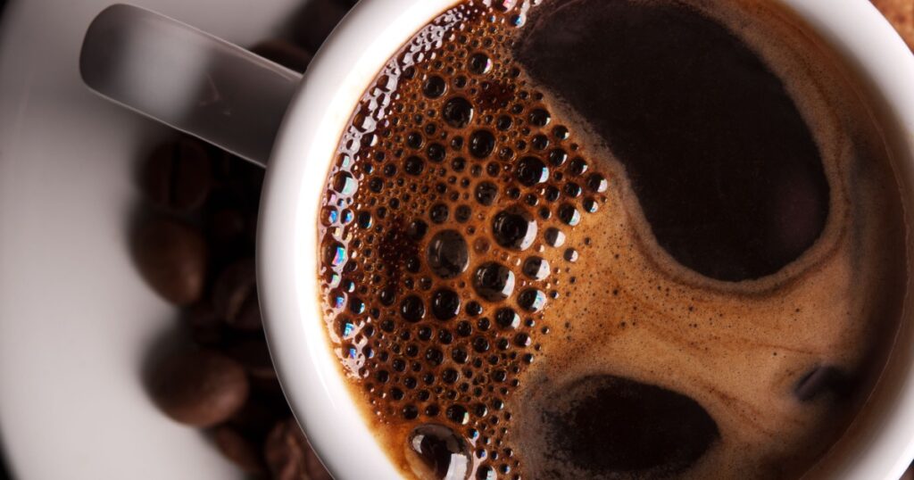 white coffee cup on background