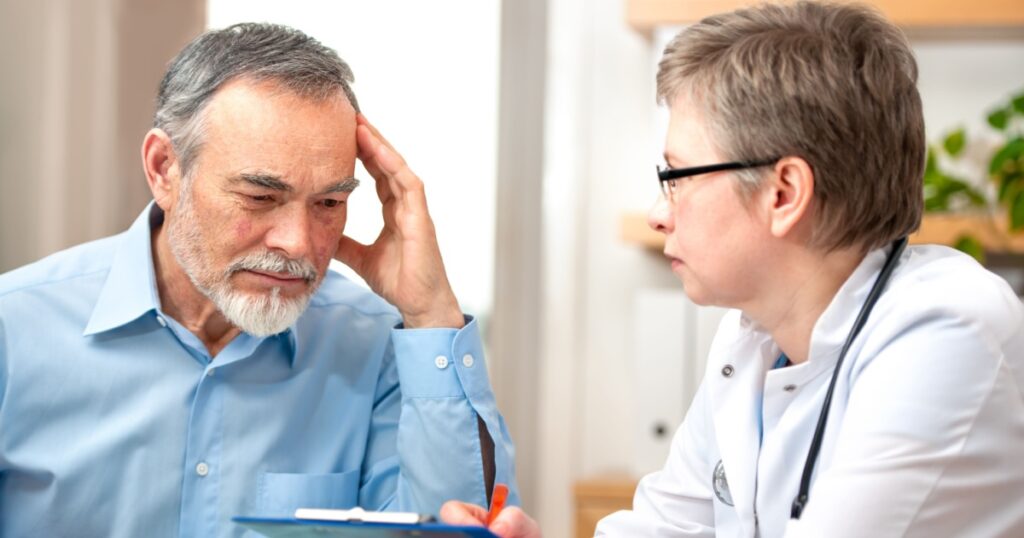 Male patient tells the doctor about his health complaints